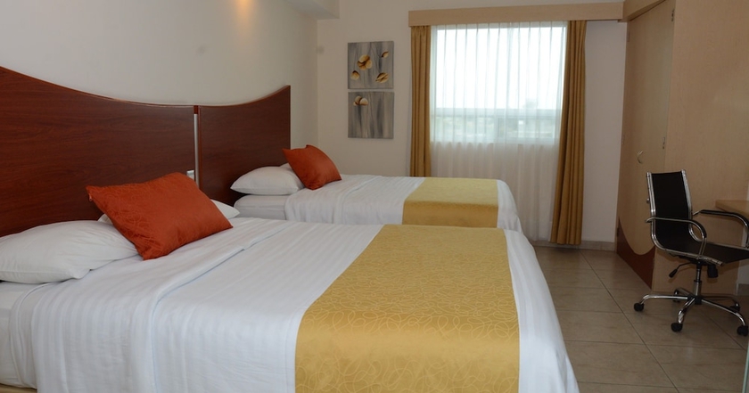 Imagen de la habitación del Hotel M&aacute;gico Inn. Foto 3