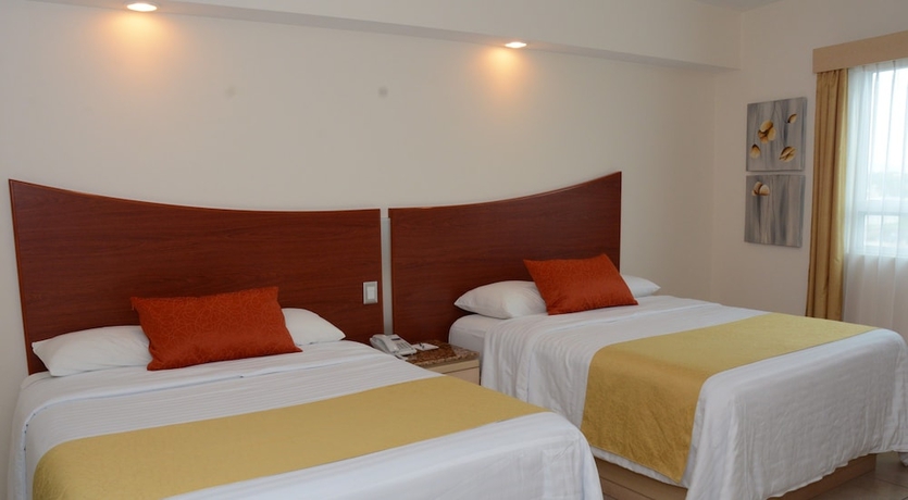 Imagen de la habitación del Hotel M&aacute;gico Inn. Foto 4