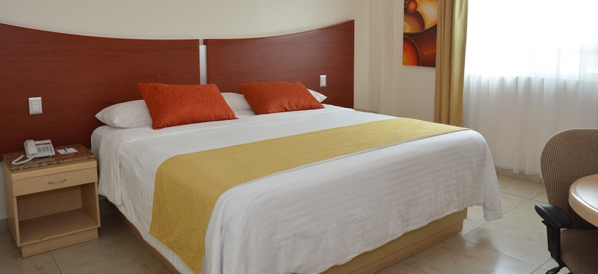 Imagen de la habitación del Hotel M&aacute;gico Inn. Foto 10