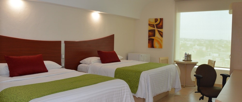 Imagen de la habitación del Hotel M&aacute;gico Inn. Foto 12