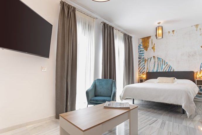 Imagen de la habitación del Hotel M&aacute;laga Rivas 34 Suites Homes. Foto 4