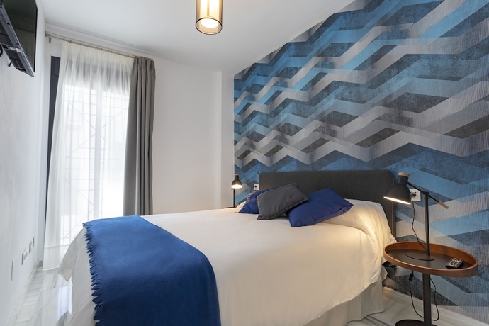Imagen de la habitación del Hotel M&aacute;laga Rivas 34 Suites Homes. Foto 7