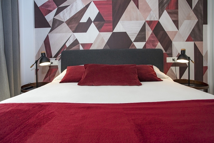 Imagen de la habitación del Hotel M&aacute;laga Rivas 34 Suites Homes. Foto 11