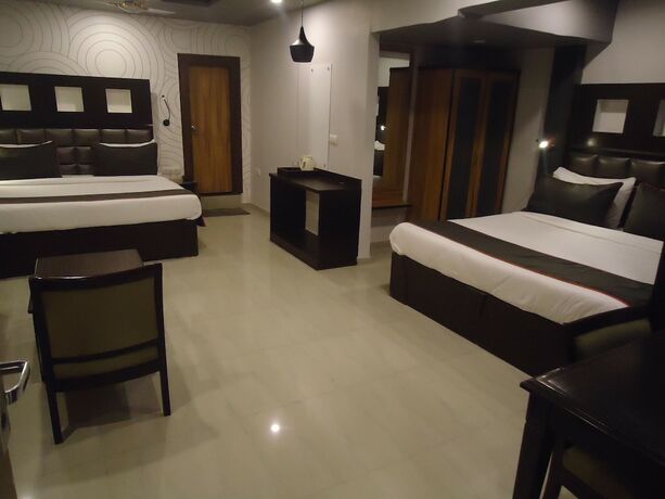 Imagen de la habitación del Hotel Maan Residency. Foto 17