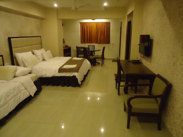 Imagen de la habitación del Hotel Maan Residency. Foto 18
