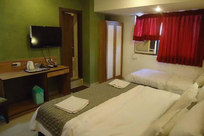 Imagen de la habitación del Hotel Maan Residency. Foto 19