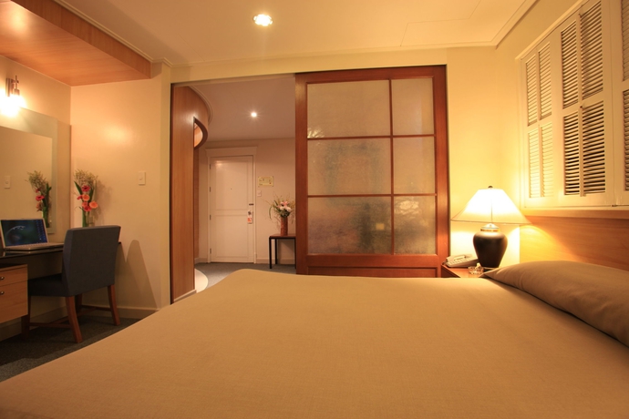 Imagen de la habitación del Hotel Mabini Mansion. Foto 11