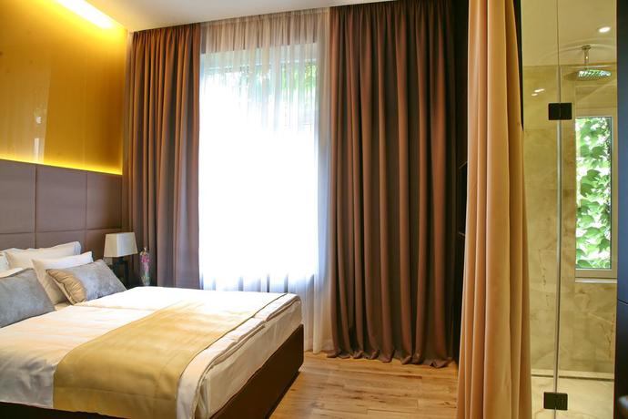 Imagen de la habitación del Hotel Maccani Luxury Suites. Foto 9