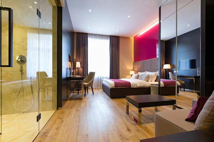 Imagen de la habitación del Hotel Maccani Luxury Suites. Foto 12