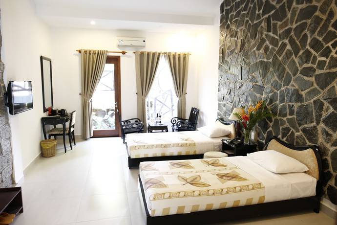 Imagen de la habitación del Hotel Madagui Forest City. Foto 11
