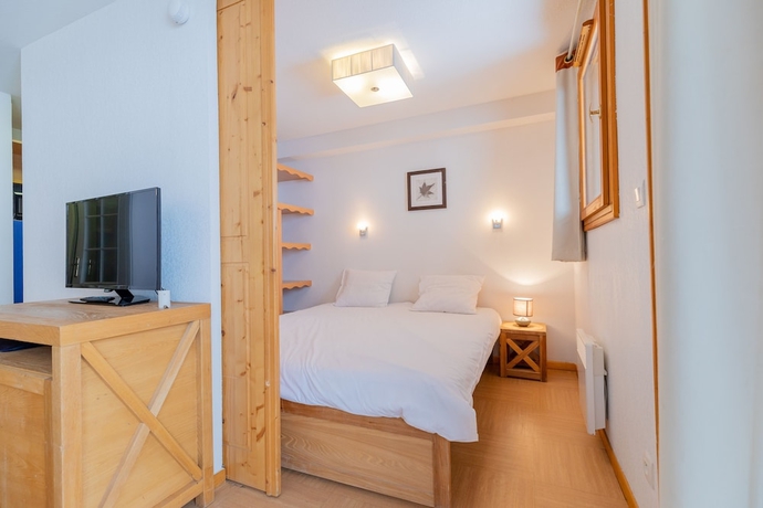 Imagen de la habitación del Hotel Madame Vacances Residence Le Parc Des Airelles. Foto 4