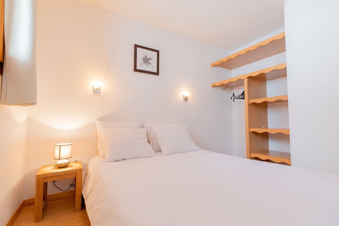 Imagen de la habitación del Hotel Madame Vacances Residence Le Parc Des Airelles. Foto 13