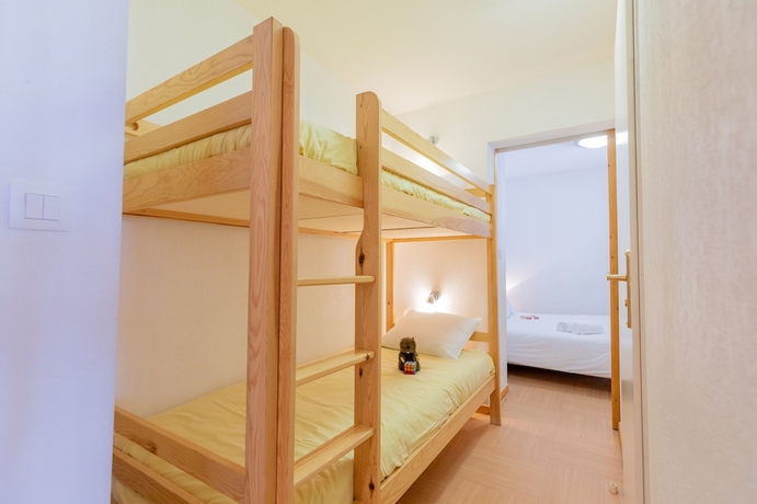 Imagen de la habitación del Hotel Madame Vacances Residence Le Parc Des Airelles. Foto 17