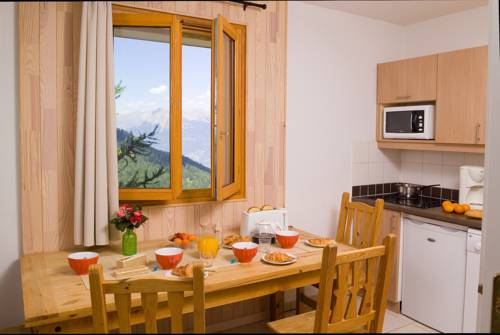 Imagen de la habitación del Hotel Madame Vacances Residence Les Balcons Des Airelles. Foto 4