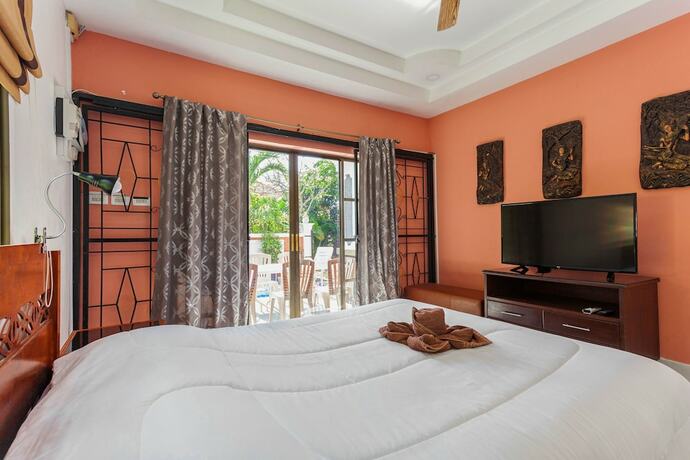 Imagen de la habitación del Hotel Madee Villa - Pattaya Holiday House Walking Street. Foto 20