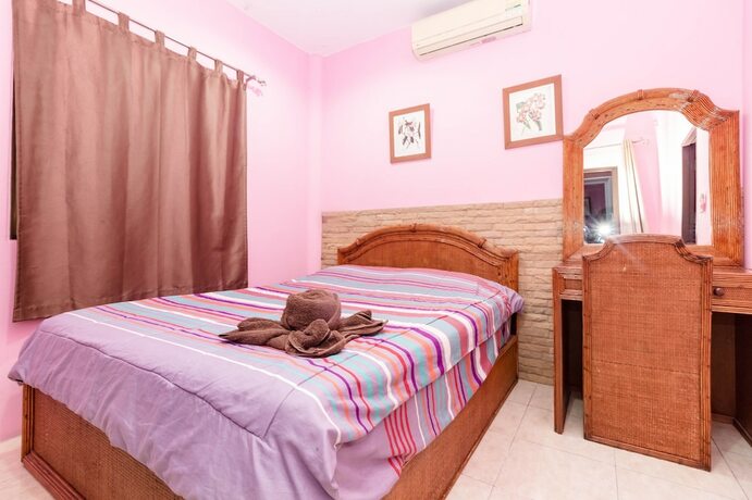 Imagen de la habitación del Hotel Madee Villa - Pattaya Holiday House Walking Street. Foto 30