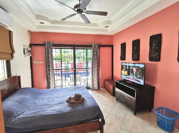 Imagen de la habitación del Hotel Madee Villa - Pattaya Holiday House Walking Street. Foto 33