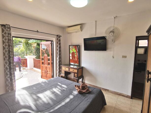 Imagen de la habitación del Hotel Madee Villa - Pattaya Holiday House Walking Street. Foto 34