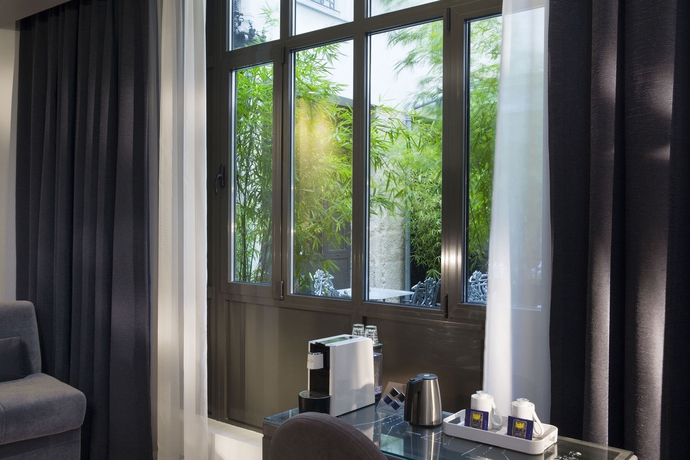 Imagen de la habitación del Hotel Mademoiselle, Gare du Nord. Foto 6