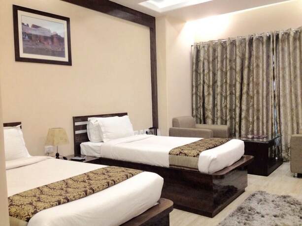 Imagen de la habitación del Hotel Madhuvan Palace. Foto 9