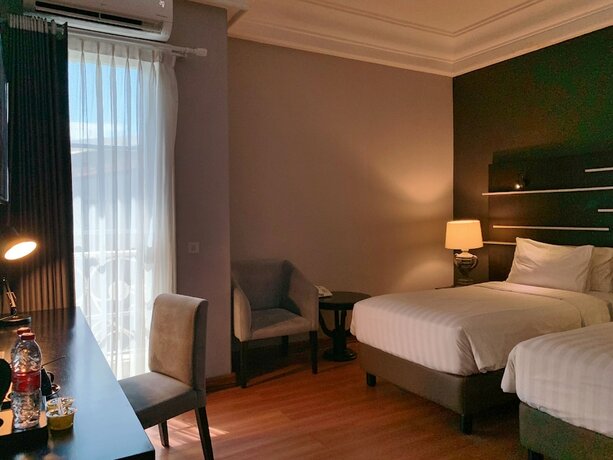 Imagen de la habitación del Hotel Madina Inn. Foto 15