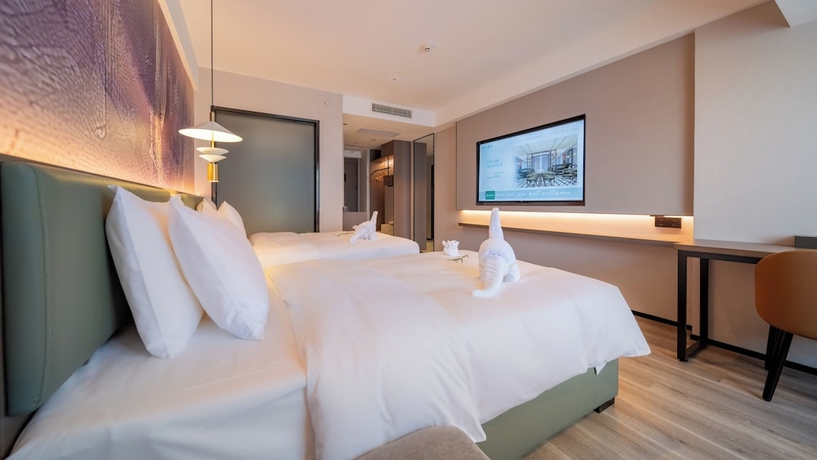 Imagen de la habitación del Hotel Madison Haikou Qilou Old Street. Foto 8