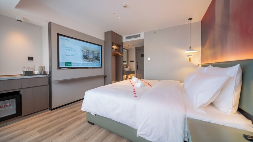 Imagen de la habitación del Hotel Madison Haikou Qilou Old Street. Foto 12
