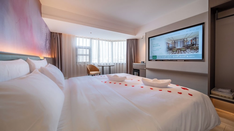 Imagen de la habitación del Hotel Madison Haikou Qilou Old Street. Foto 13