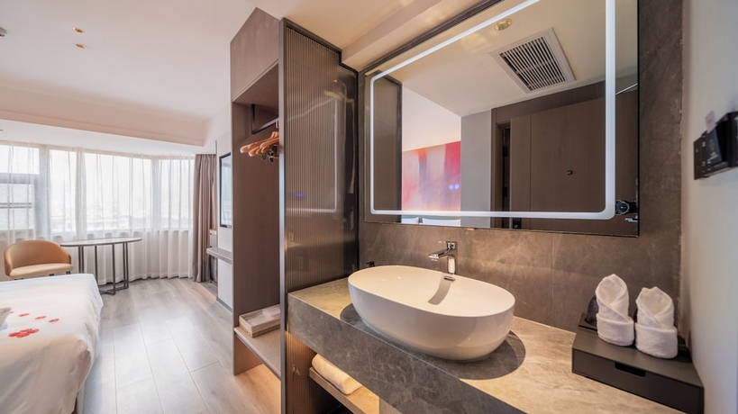 Imagen de la habitación del Hotel Madison Haikou Qilou Old Street. Foto 14