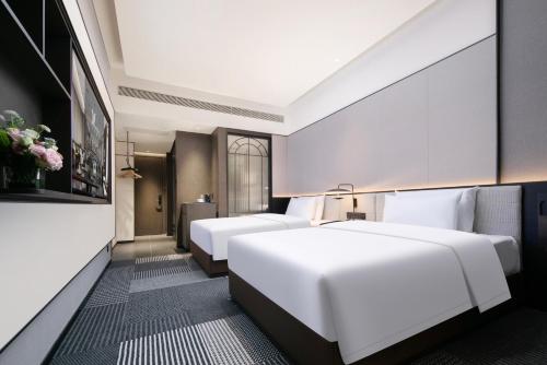 Imagen de la habitación del Hotel Madison Wuhan Jianghan Road Pedestrian Street. Foto 18