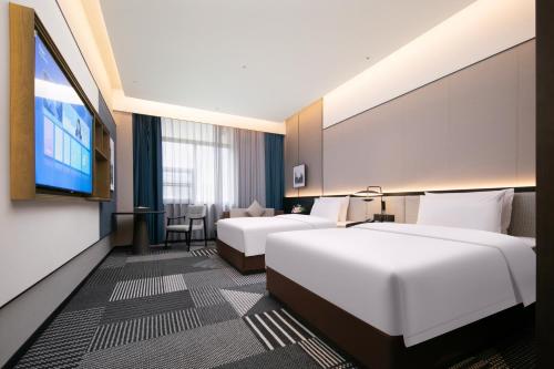 Imagen de la habitación del Hotel Madison Wuhan Jianghan Road Pedestrian Street. Foto 19