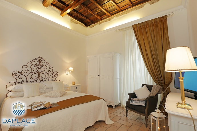 Imagen de la habitación del Hotel Madonna De' Monti Suites. Foto 4