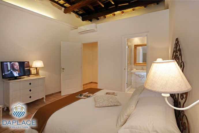 Imagen de la habitación del Hotel Madonna De’ Monti Suites. Foto 5
