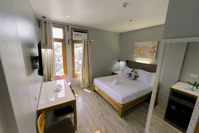 Imagen de la habitación del Hotel Madonna Hometel and Suites New Pandan. Foto 5