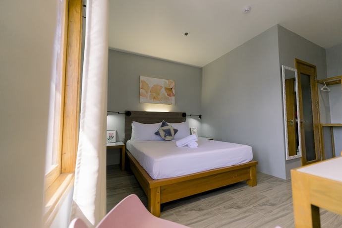 Imagen de la habitación del Hotel Madonna Hometel and Suites New Pandan. Foto 15