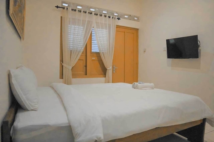 Imagen de la habitación del Hotel Maerakatja Yogyakarta. Foto 10
