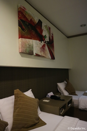 Imagen de la habitación del Hotel Magallanes Square. Foto 15