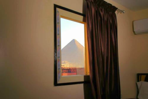 Imagen de la habitación del Hotel MagiC Pyramids HoteL. Foto 13