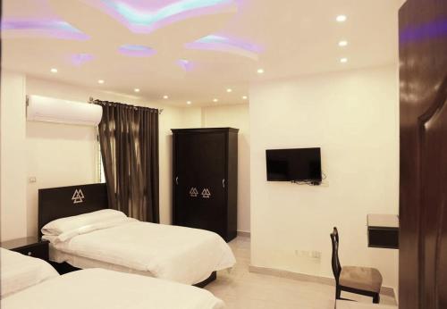 Imagen de la habitación del Hotel MagiC Pyramids HoteL. Foto 19