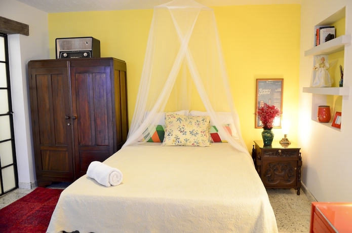 Imagen de la habitación del Hotel Magic Garden House. Foto 10