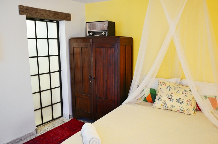 Imagen de la habitación del Hotel Magic Garden House. Foto 11