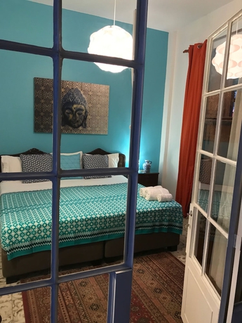 Imagen de la habitación del Hotel Magic Garden House. Foto 12