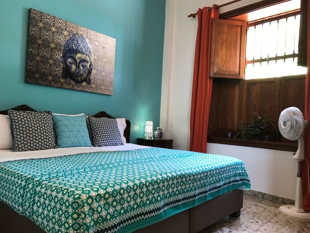 Imagen de la habitación del Hotel Magic Garden House. Foto 13