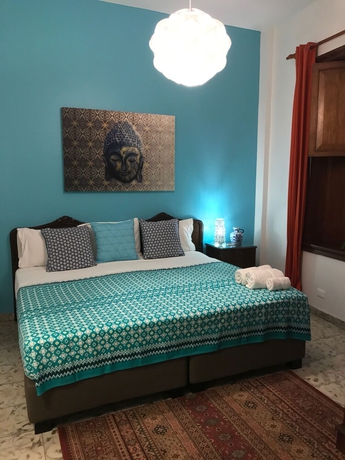 Imagen de la habitación del Hotel Magic Garden House. Foto 14