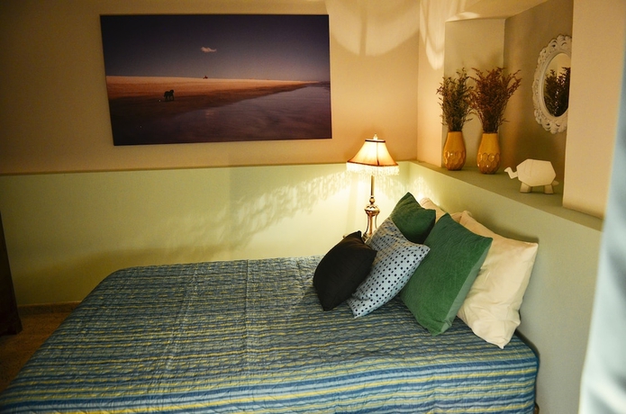 Imagen de la habitación del Hotel Magic Garden House. Foto 19