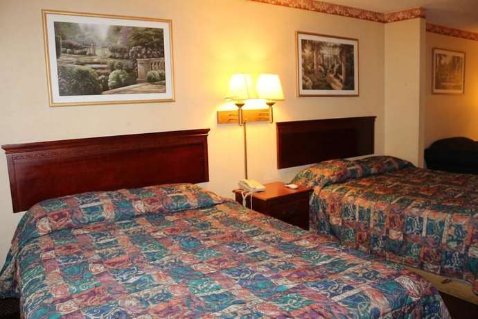 Imagen de la habitación del Hotel Magnolia Bay and Suites. Foto 5