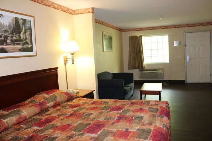 Imagen de la habitación del Hotel Magnolia Bay and Suites. Foto 6