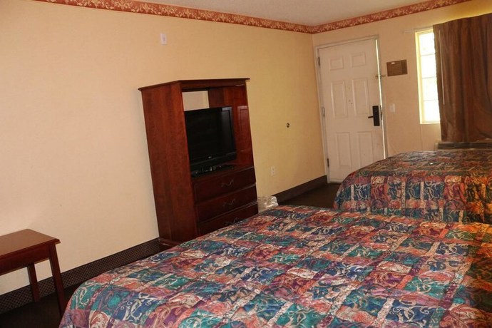 Imagen de la habitación del Hotel Magnolia Bay and Suites. Foto 7