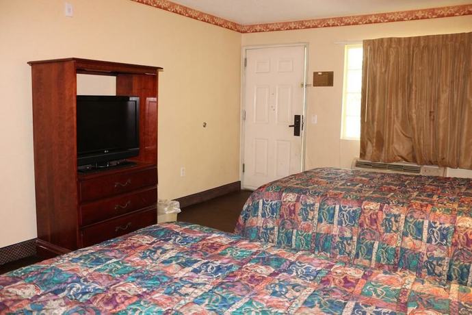 Imagen de la habitación del Hotel Magnolia Bay and Suites. Foto 8