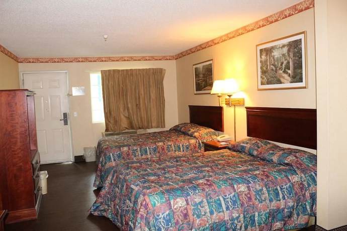Imagen de la habitación del Hotel Magnolia Bay and Suites. Foto 9